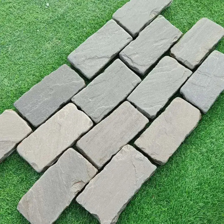 Kandla grey sandstone tumbled cobble setts 200x100x50